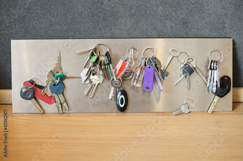 Photo: Assorted keys on a metal sheet Assorted keys on a metal sheet