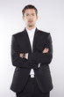 fashion shot of an elegant young man wearing suit