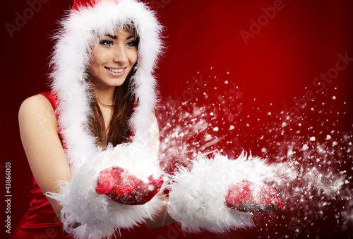 Photo: Photo of fashion Christmas girl blowing snow. Photo of fashion Christmas girl blowing snow.