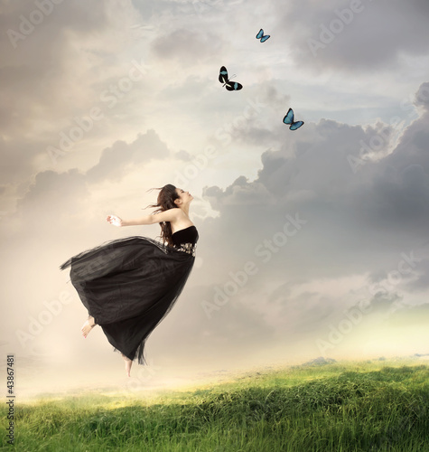 Photo: Girl Jumping in the Air Girl Jumping in the Air