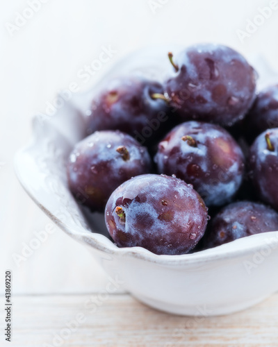 Photo: Fresh plums in a bowl Fresh plums in a bowl