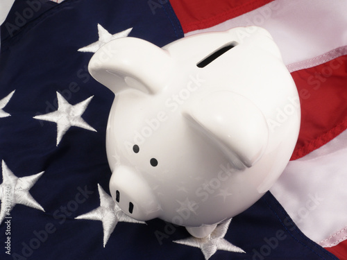 Photo: Piggy Bank Over American Flag Piggy Bank Over American Flag