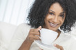 Photo: African American Woman Drinking Cup of Coffee or Tea African American Woman Drinking Cup of Coffee or Tea