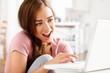 Photo: attractive young teenager surfing the internet attractive young teenager surfing the internet