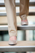 woman walking down stairs