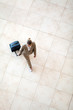 overhead view of young woman walking at airport