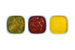 ketchup mustard pickles on bowl