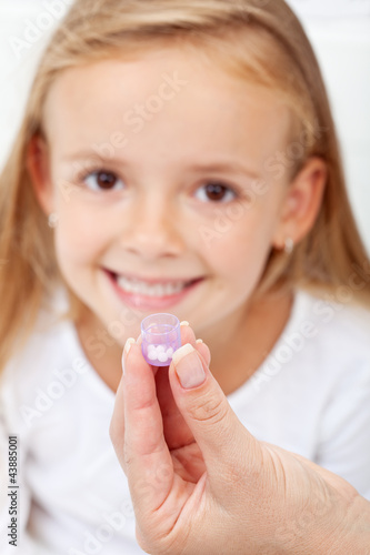 Photo: Girl receiving homeopathic medication Girl receiving homeopathic medication