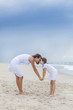 Woman & Child, Mother, Daughter Rubbing Noses On Beach
