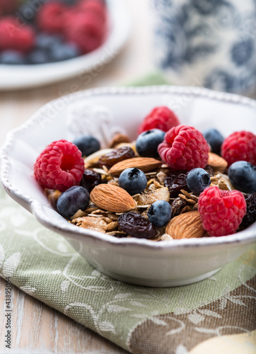 Photo: Muesli with fresh fruits, almonds and raisins Muesli with fresh fruits, almonds and raisins