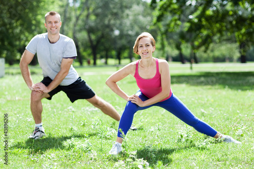 Photo: Couple Exercising In Park Couple Exercising In Park