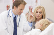Photo: Male Doctor Examining Boy Child With Mother Male Doctor Examining Boy Child With Mother