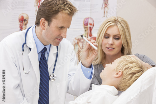 Photo: Male Doctor Examining Boy Child With Mother Male Doctor Examining Boy Child With Mother