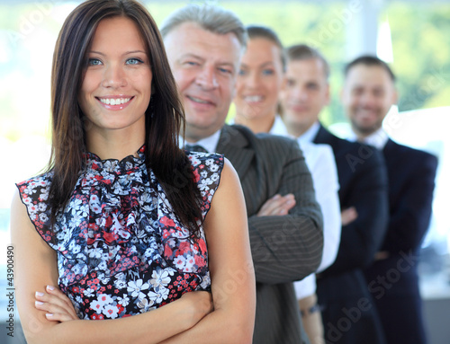 Photo: young businesswoman with her successful business team young businesswoman with her successful business team