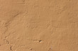 Simple yellowed plaster cement wall background
