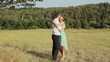 Video: Young couple hugging on the yellow grass Young couple hugging on the yellow grass