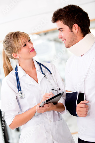Photo: Doctor with an injured patient Doctor with an injured patient