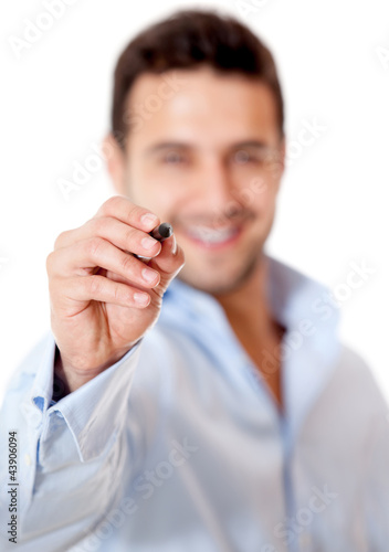 Photo: Business man holding a pen Business man holding a pen