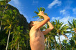 Foto: Man drinking a fresh coconut milk Man drinking a fresh coconut milk