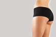Slim tanned woman's body.