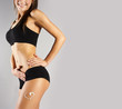Tanned skinny woman in the studio