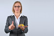 Businesswoman holding and showing a toy car on her hand