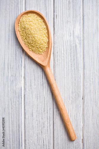Photo: couscous in wooden spoon couscous in wooden spoon