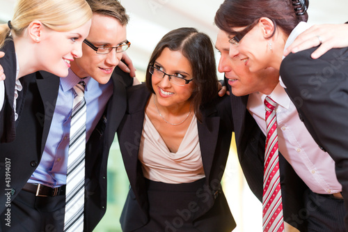 Photo: Business - group of businesspeople in office Business - group of businesspeople in office