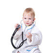 Little blond boy dressed as a doctor and with stethoscope