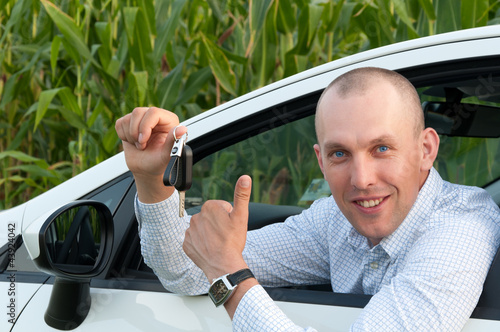 Photo: smiling man sitting in the car smiling man sitting in the car