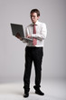Nerdy businessman holding a laptop
