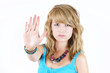 Young blond girl making STOP gesture