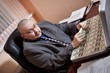 Serious businessman with the suitcase full of dollars