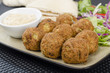 Falafel - Deep fried chickpeas balls with tahini, salad & pitta