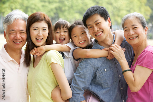Photo: Portrait Of Multi-Generation Chinese Family Relaxing In Park Portrait Of Multi-Generation Chinese Family Relaxing In Park