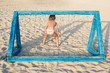 Girl plays beach soccer