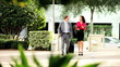 Businessman and Assistant Returning from Travel