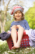 Young Boy Sitting In Laundry Basket