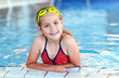 Girl with goggles in swimming pool