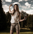 Photo: beautiful woman with golfclub on her shoulders beautiful woman with golfclub on her shoulders