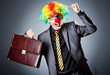 Foto: Businessman with clown wig and face paint Businessman with clown wig and face paint