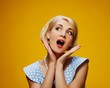 Surprised woman in blue dress