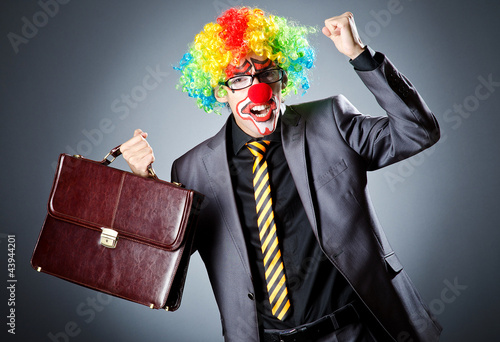 Photo: Businessman with clown wig and face paint Businessman with clown wig and face paint