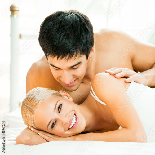 Photo: Young embracing cheerful attractive couple Young embracing cheerful attractive couple