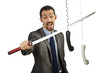 Angry businessman cutting the phone cable