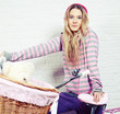 Foto: young woman with pink bike at home young woman with pink bike at home