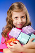 Little girl with giftboxes