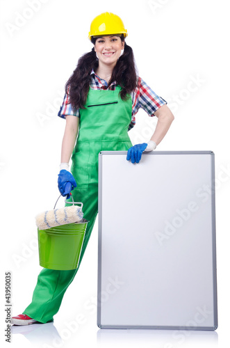 Photo: Woman builder with blank board Woman builder with blank board