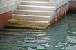 marble stairs that descend to the sea