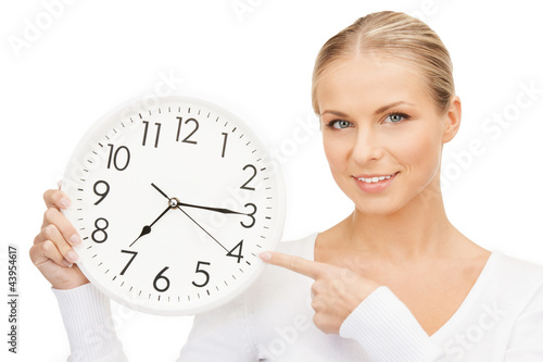 Photo: woman holding big clock woman holding big clock